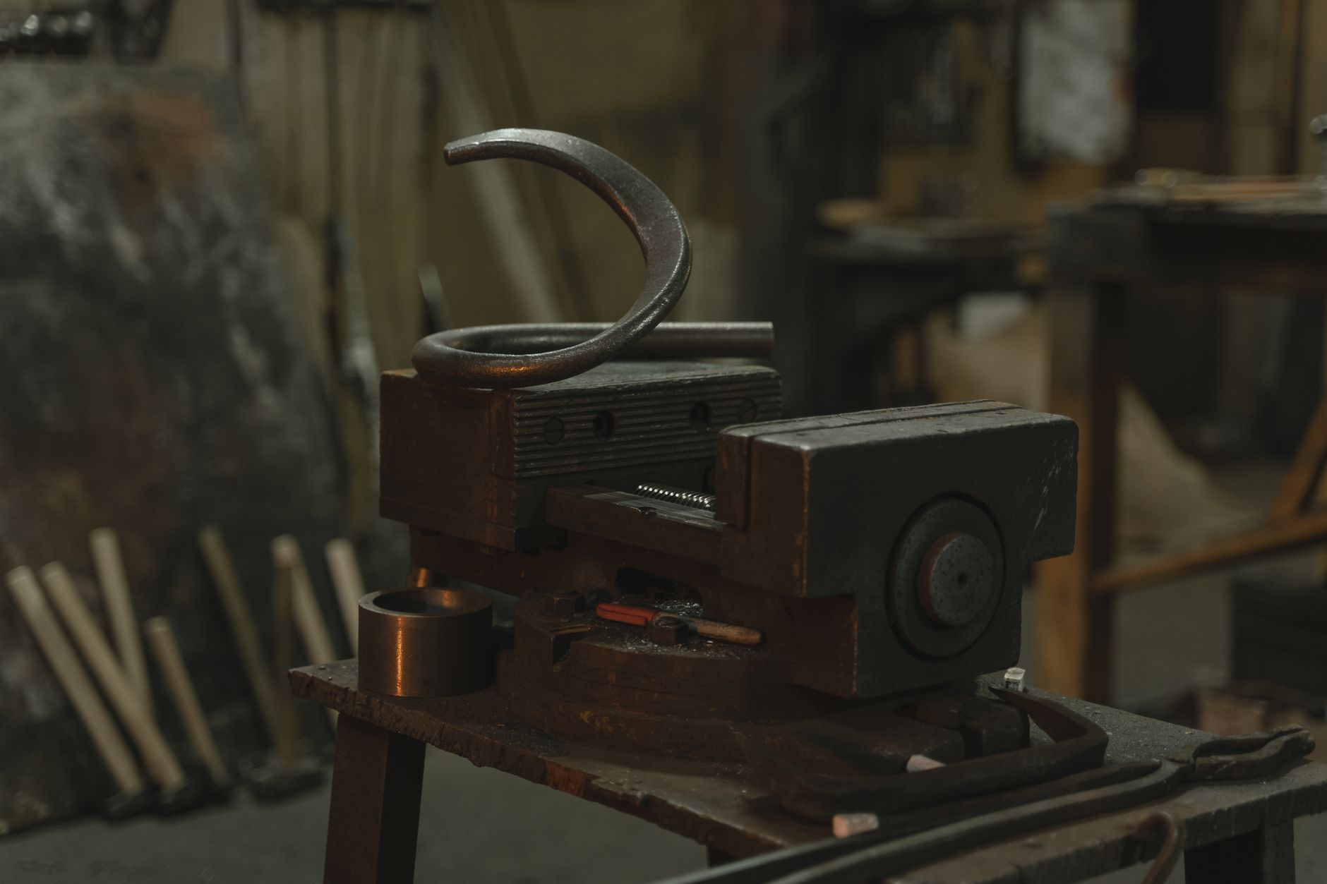 Close-up of metalwork equipment in an industrial workshop setting.