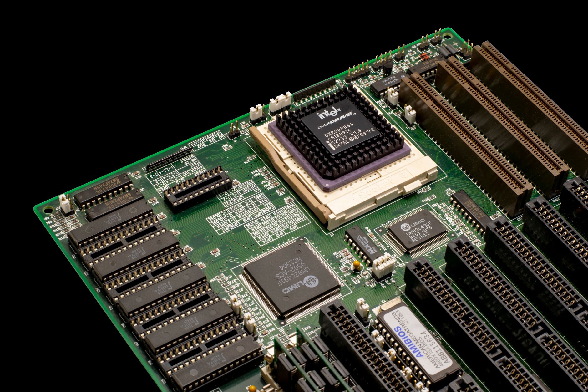 Detailed shot of a vintage motherboard showcasing microprocessor and electronic components.