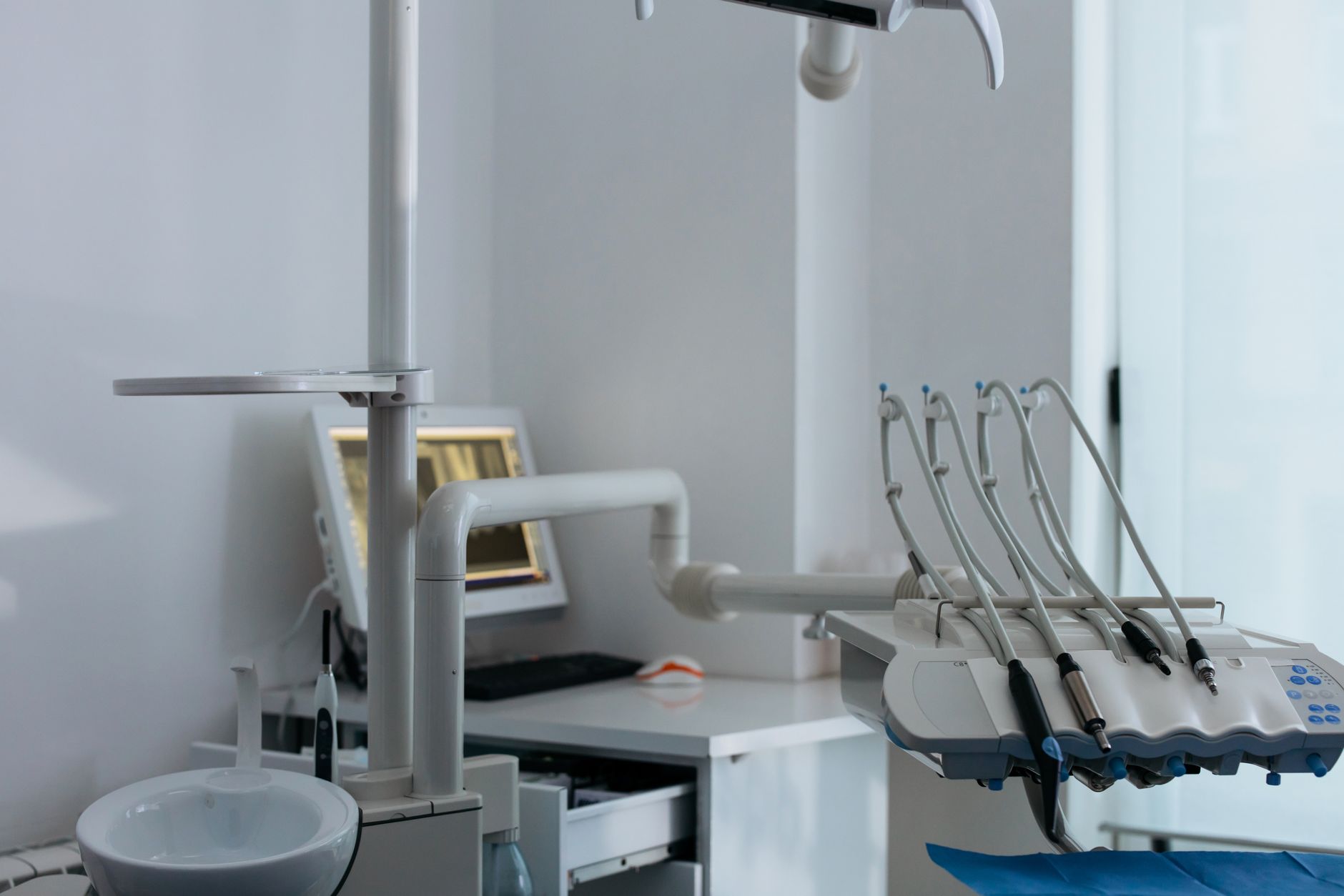 Close-up of advanced dental chair setup with dental instruments in a clinic.