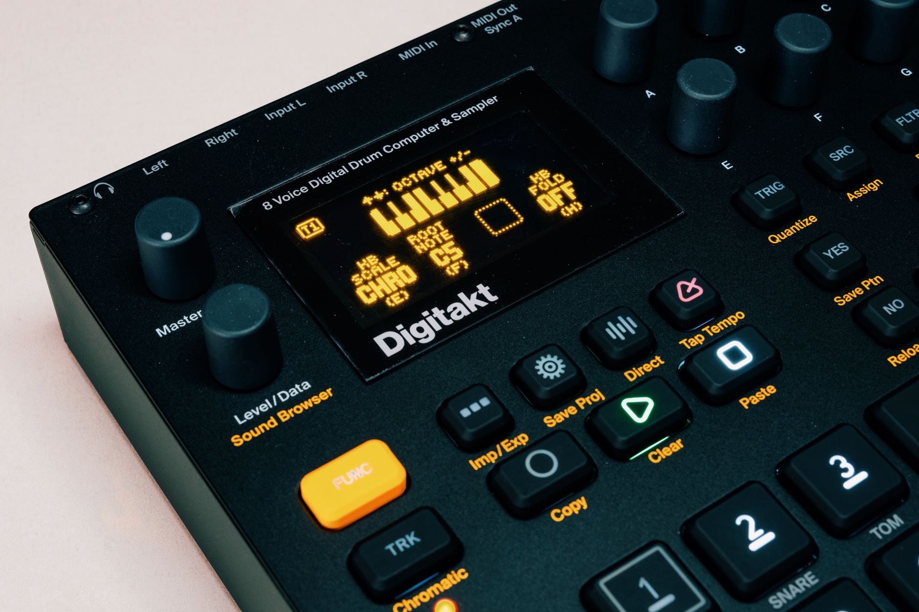 High-angle view of the Elektron Digitakt music sampler showcasing buttons and display.